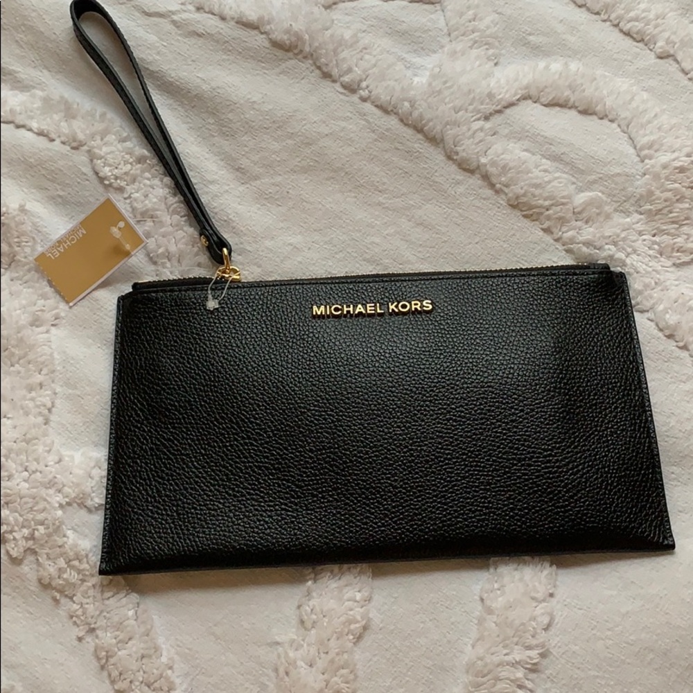 A Micheal Kors Hand clutch wristlet